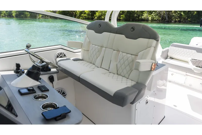 Slide: The Image of Luxurious 2026 Edgewater boat interior with plush seating and modern steering console. - 11