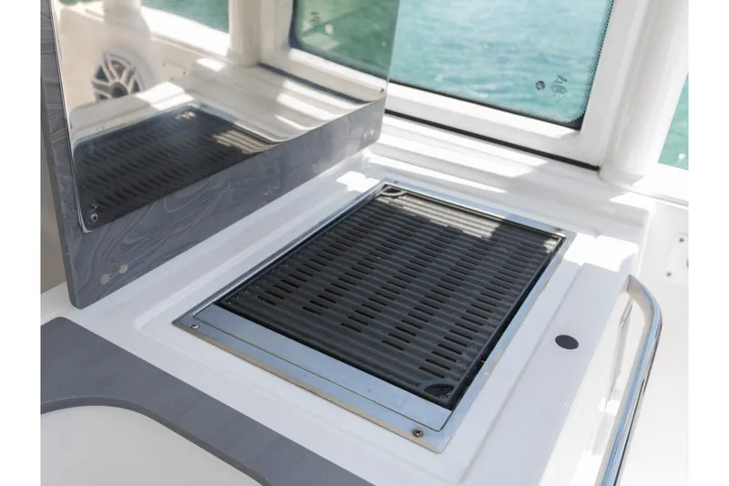 Slide: The Image of Edgewater 2026 boat grill area with sleek design and modern features. - 14