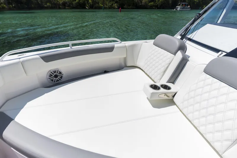 Slide: The Image of Luxurious 2026 Edgewater boat interior with quilted seating and cup holders on a sunny day. - 3