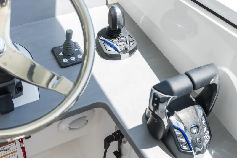 Slide: The Image of Edgewater 2026 boat controls featuring steering wheel and advanced joystick system. - 7