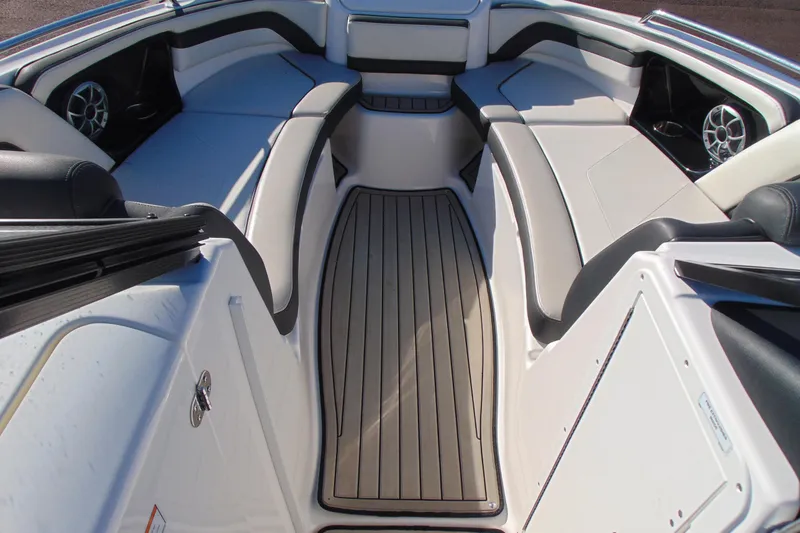 Slide: The Image of 2020 Yamaha Boats 242SE interior with spacious seating and sleek design. - 12