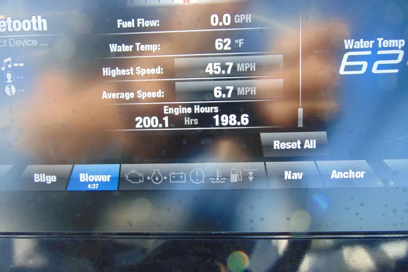Slide: The Image of Dashboard of 2020 Yamaha Boats 242SE showing engine hours and water temperature. - 16