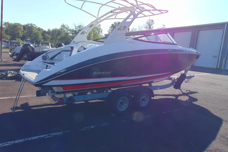 Slide: The Image of 2020 Yamaha Boats 242SE on trailer in parking lot, side view. - 5