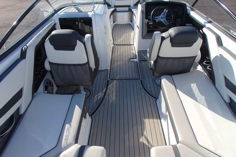 Slide: The Image of 2020 Yamaha Boats 242SE interior with sleek seating and modern dashboard design. - 8