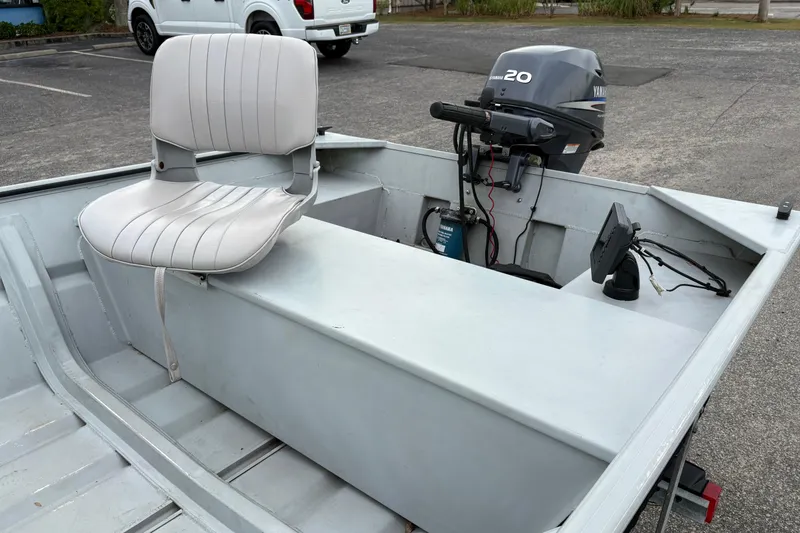 Slide: The Image of 2011 SeaArk 1448 MV boat with Yamaha 20HP motor and swivel seat in parking lot. - 8