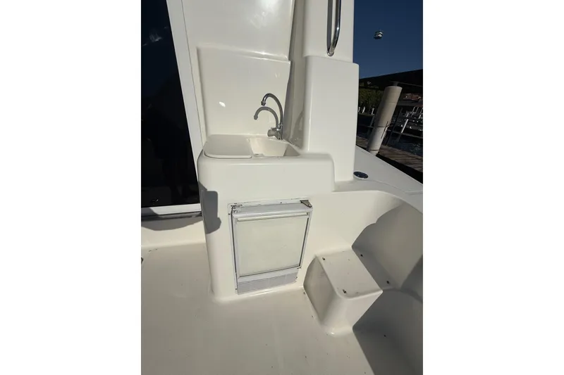 Slide: The Image of 2001 Silverton 42 Convertible yacht sink and storage area on deck. - 16