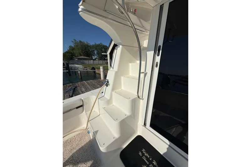 Slide: The Image of Staircase on a 2001 Silverton 42 Convertible yacht, dockside view. - 20