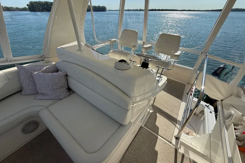 Slide: The Image of Luxurious interior of 2001 Silverton 42 Convertible yacht with scenic water view. - 22