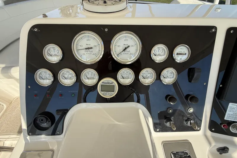 Slide: The Image of Instrument panel of a 2001 Silverton 42 Convertible boat with gauges and controls. - 26