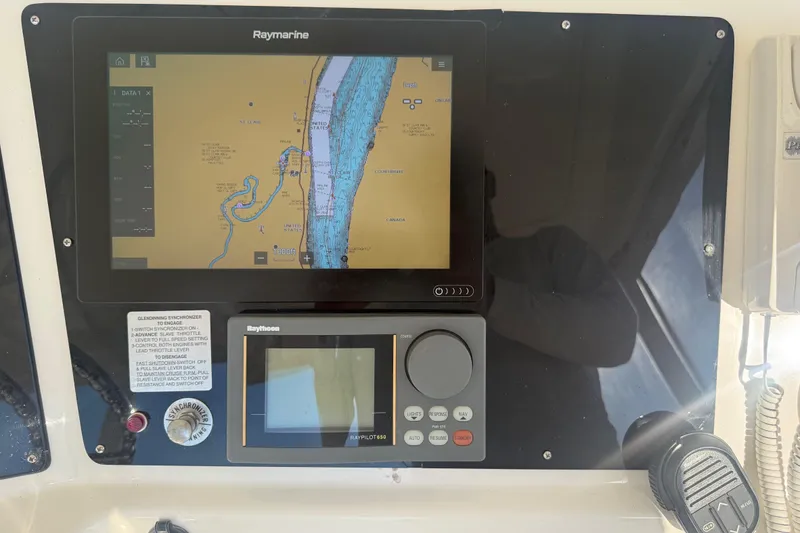 Slide: The Image of Navigation system on a 2001 Silverton 42 Convertible yacht dashboard. - 27