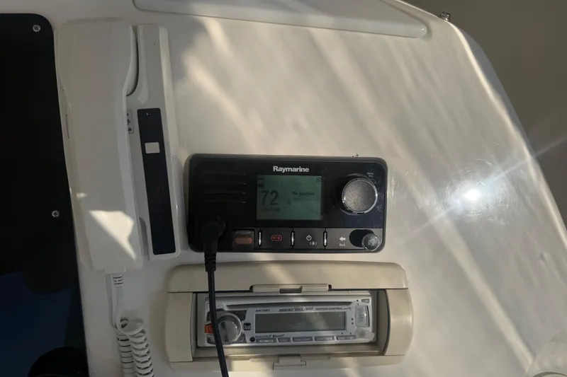 Slide: The Image of Control panel on a 2001 Silverton 42 Convertible yacht with Raymarine equipment. - 28