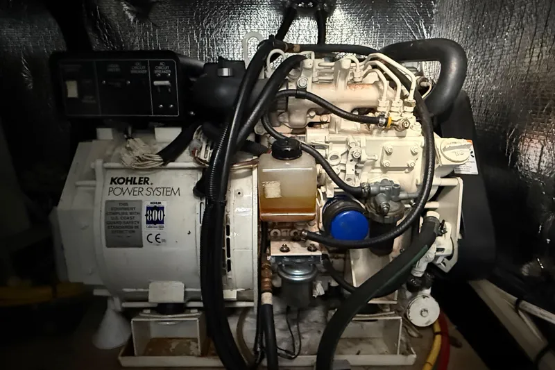 Slide: The Image of Kohler power system generator in a 2001 Silverton 42 Convertible yacht engine room. - 47