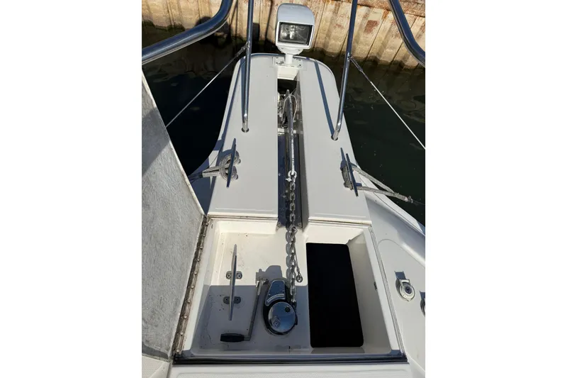 Slide: The Image of Bow of 2001 Silverton 42 Convertible yacht with anchor chain and winch. - 9