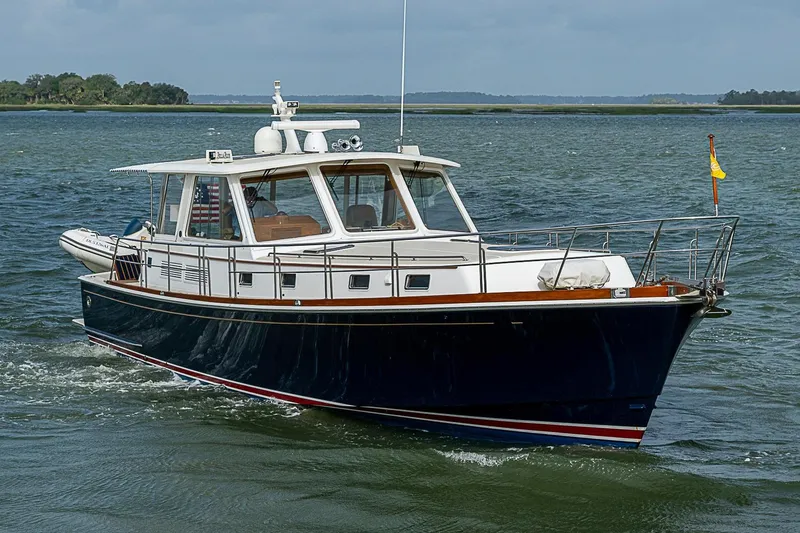 Slide: The Image of 2004 Grand Banks 49 Eastbay HX yacht cruising on open water. - 1