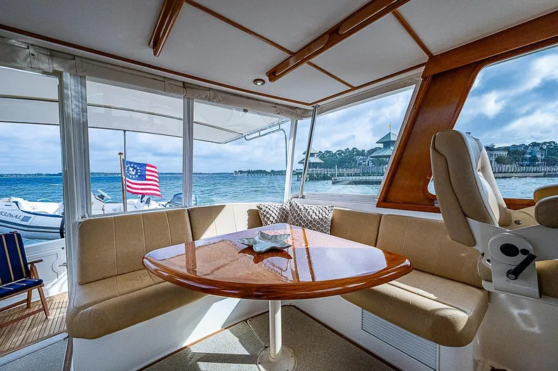 Slide: The Image of Interior of 2004 Grand Banks 49 Eastbay HX yacht with ocean view and seating area. - 10