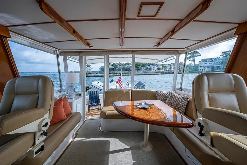 Slide: The Image of Luxurious interior of 2004 Grand Banks 49 Eastbay HX yacht with waterfront view. - 12