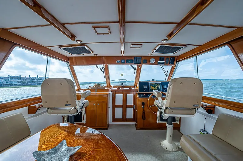 Slide: The Image of Interior of 2004 Grand Banks 49 Eastbay HX yacht with helm and seating area. - 14