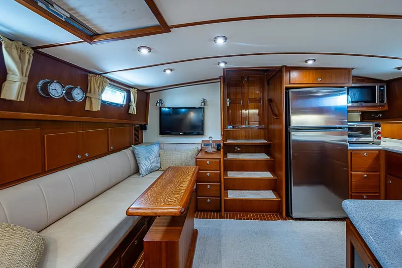 Slide: The Image of Luxurious interior of 2004 Grand Banks 49 Eastbay HX yacht with elegant wood finishes. - 17