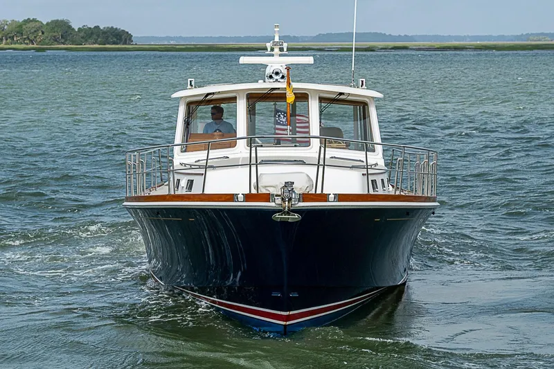 Slide: The Image of 2004 Grand Banks 49 Eastbay HX yacht cruising on open water. - 2