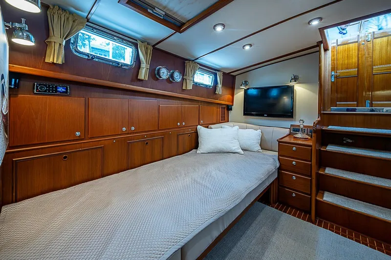 Slide: The Image of Luxurious cabin interior of 2004 Grand Banks 49 Eastbay HX yacht with wood paneling. - 20