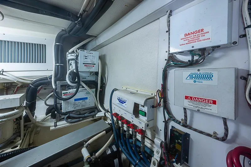 Slide: The Image of Engine room of 2004 Grand Banks 49 Eastbay HX with marine air systems and wiring. - 33