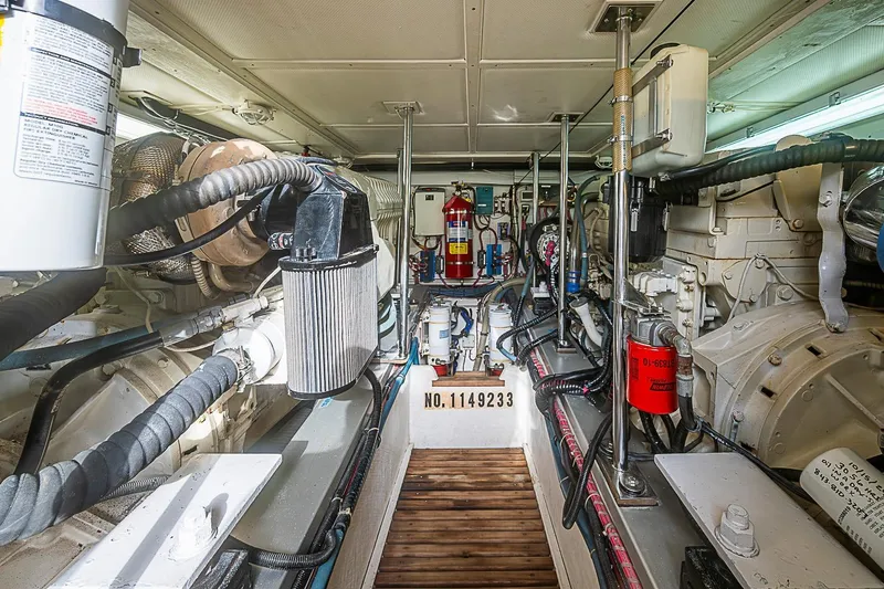 Slide: The Image of Engine room of 2004 Grand Banks 49 Eastbay HX, showcasing mechanical components and systems. - 35