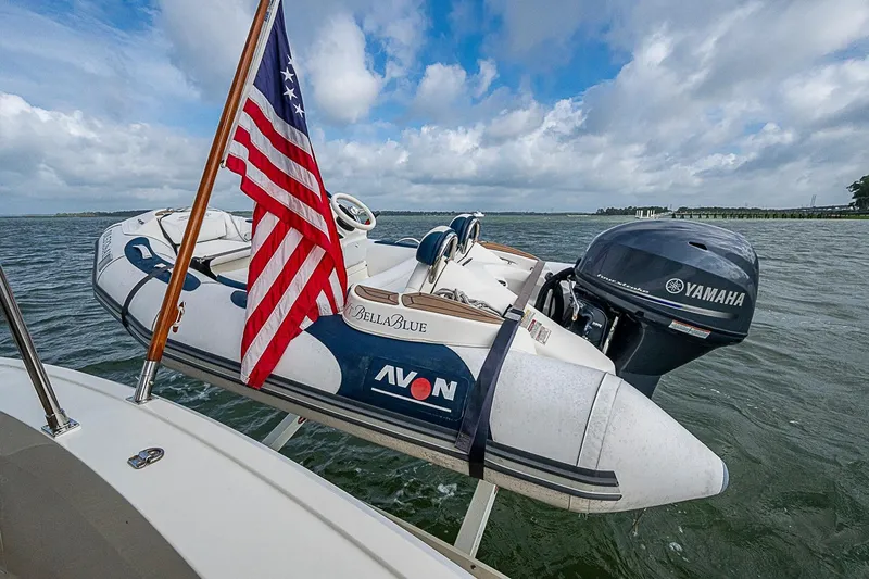 Slide: The Image of American flag on a 2004 Grand Banks 49 Eastbay HX with Avon dinghy and Yamaha motor. - 39