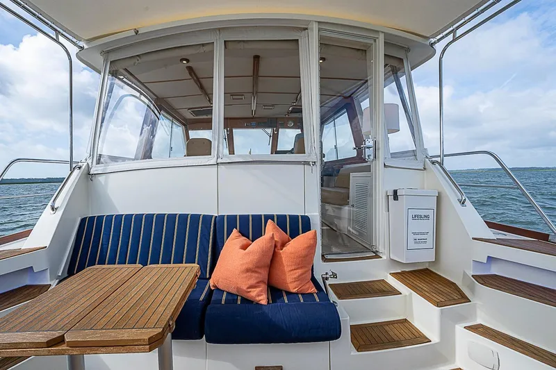 Slide: The Image of 2004 Grand Banks 49 Eastbay HX yacht with cozy seating and ocean view. - 8