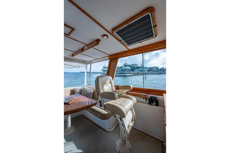 Slide: The Image of Interior of 2004 Grand Banks 49 Eastbay HX yacht with helm seat and ocean view. - 9