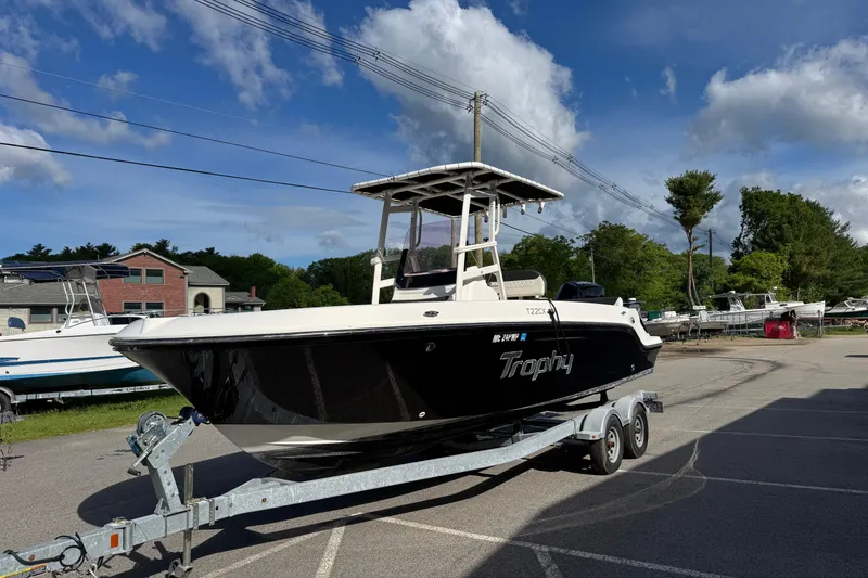 The Image of 2021 Trophy T22CX boat on trailer in sunny outdoor setting. - 0