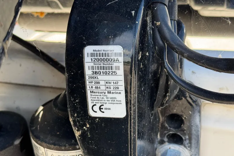 Slide: The Image of Label on Mercury Marine engine, displaying model and serial numbers, specifications, and compliance information. - 10