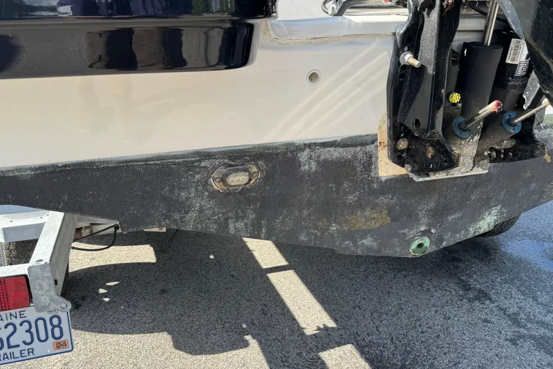 Slide: The Image of Rear view of a 2021 Trophy T22CX boat on a trailer. - 5