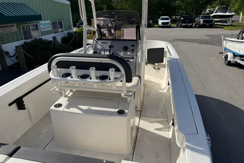 Slide: The Image of 2021 Trophy T22CX boat interior with steering console and rod holders. - 6
