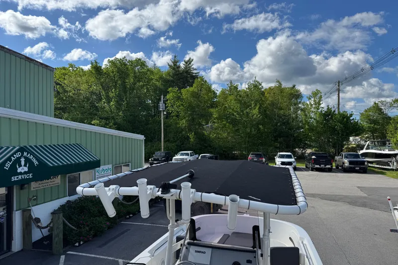 Slide: The Image of 2021 Trophy T22CX boat at Island Marine Service, under a partly cloudy sky. - 7