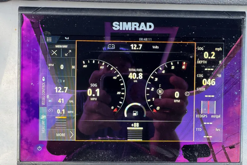 Slide: The Image of Simrad display on 2021 Trophy T22CX showing vessel controls and fuel data. - 9