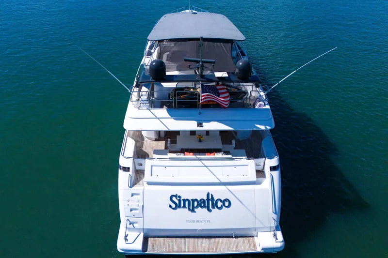 Slide: The Image of Ferretti Yachts Custom Line 94, 2002 model, docked with American flag, aerial view. - 12