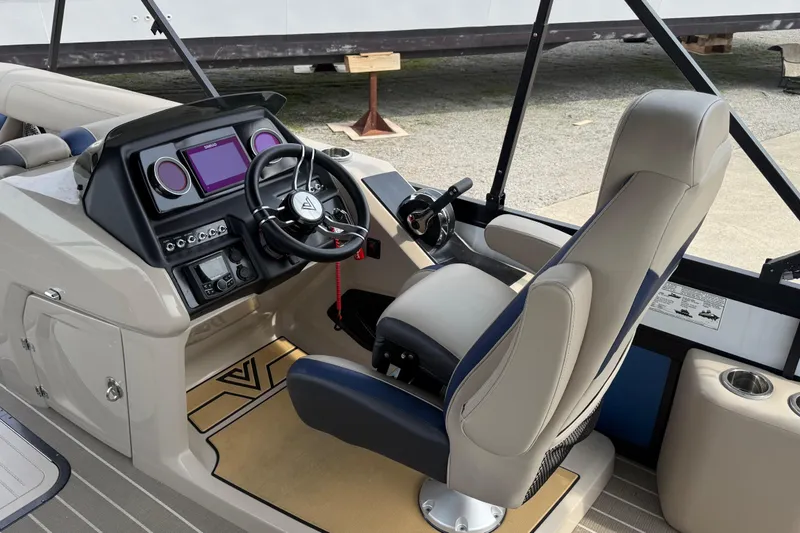 Slide: The Image of Interior view of 2022 Viaggio Diamante S 26 boat cockpit with steering wheel and controls. - 11