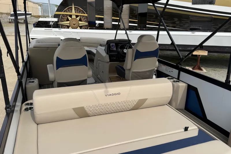 Slide: The Image of Interior of 2022 Viaggio Diamante S 26 boat with beige seating and modern dashboard. - 13
