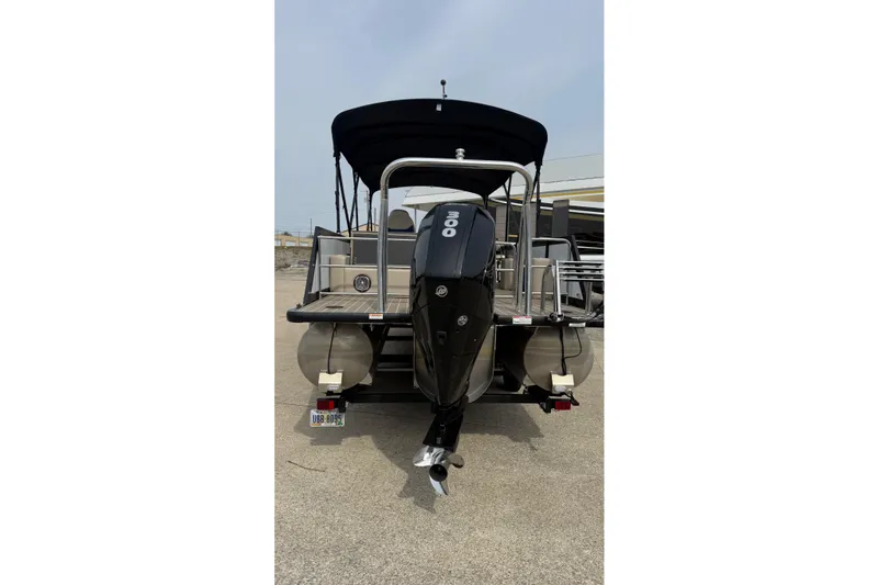 Slide: The Image of 2022 Viaggio Diamante S 26 pontoon boat with powerful outboard motor, rear view. - 6