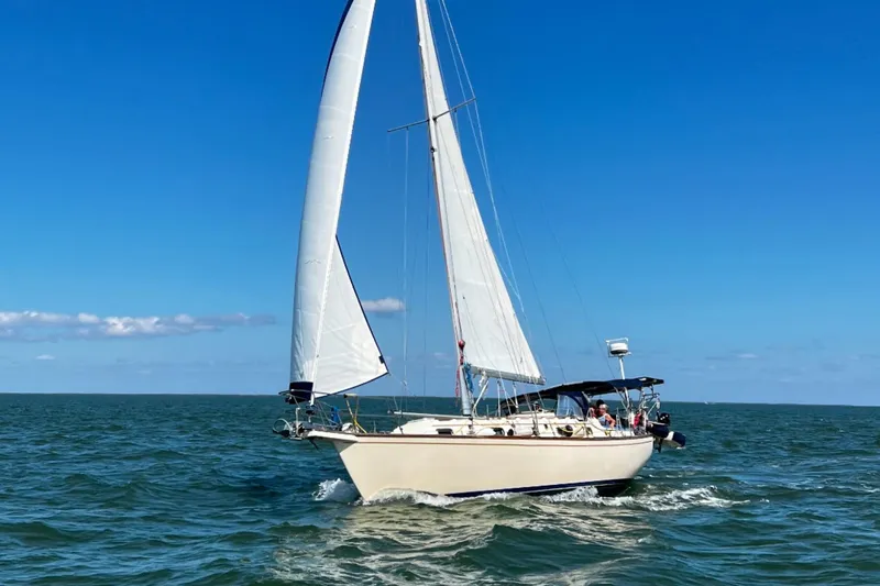The Image of Sailing yacht Island Packet 37, 1995 model, cruising on open water under clear blue skies. - 0