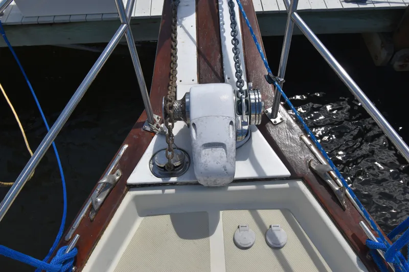 Slide: The Image of Bow of 1995 Island Packet 37 sailboat with anchor chain and winch. - 3