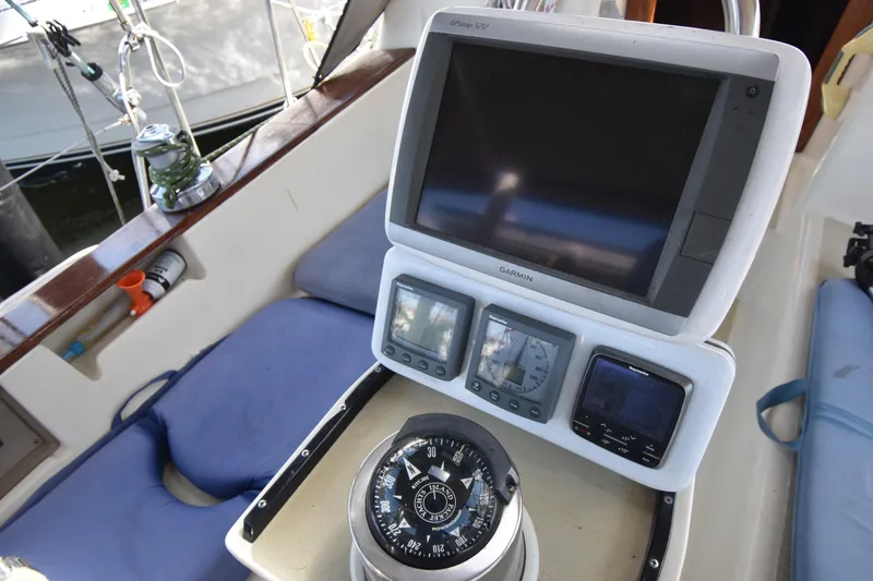 Slide: The Image of Cockpit of 1995 Island Packet 37 sailboat with navigation instruments and compass. - 5