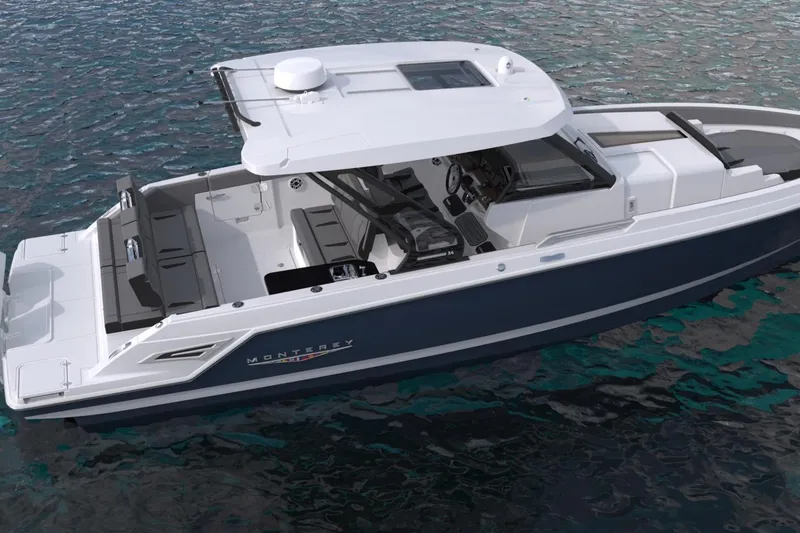 Slide: The Image of 2027 Monterey Elite 34 OB boat on water, featuring sleek design and spacious deck. - 3
