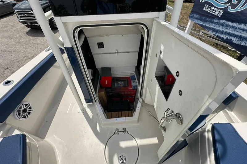 Slide: The Image of 2026 Ranger 2660 Bay boat storage compartment with various items inside. - 15