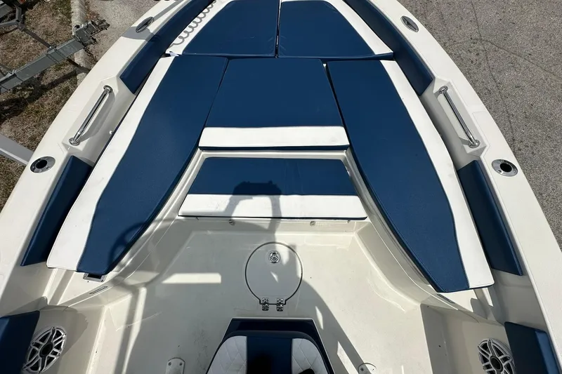 Slide: The Image of 2026 Ranger 2660 Bay boat interior with blue and white seating. - 18
