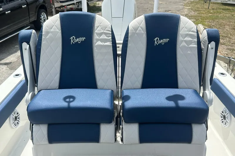 Slide: The Image of 2026 Ranger 2660 Bay boat seats, blue and white design, featuring embroidered logo. - 23