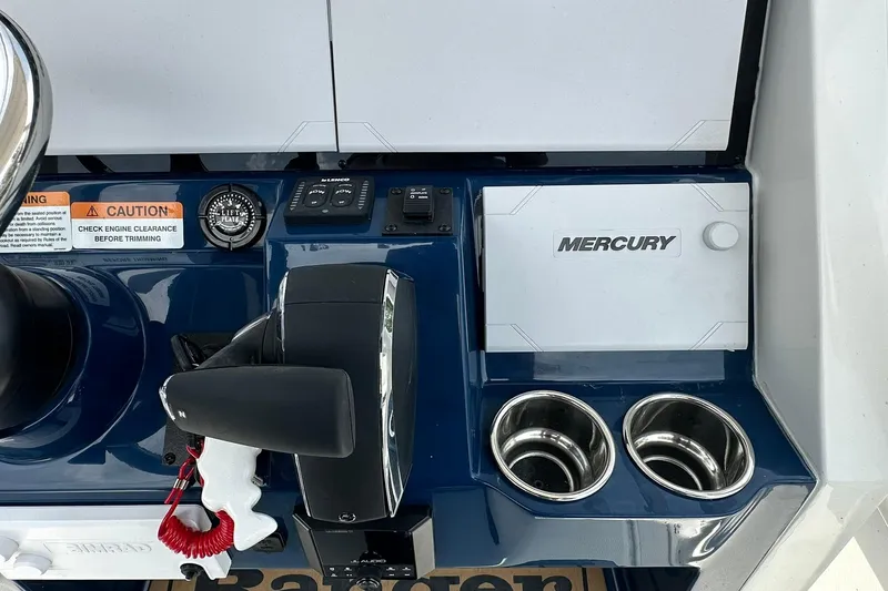 Slide: The Image of Control panel of 2026 Ranger 2660 Bay boat with Mercury components and cup holders. - 26