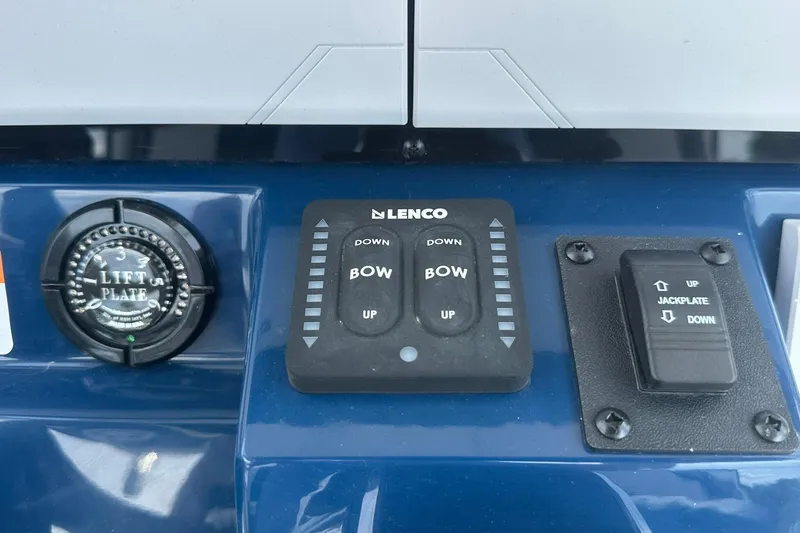 Slide: The Image of Control panel of a 2026 Ranger 2660 Bay boat with lift and jackplate switches. - 27