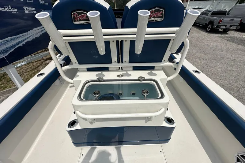 Slide: The Image of 2026 Ranger 2660 Bay boat interior with rod holders and livewell. - 34