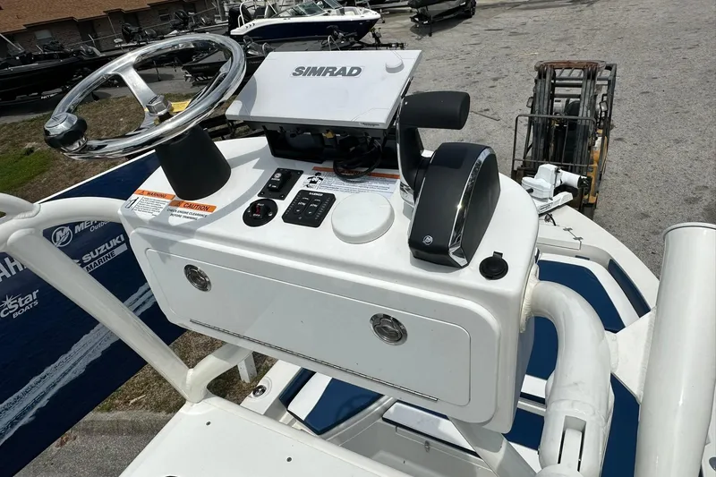 Slide: The Image of Control panel of 2026 Ranger 2660 Bay boat with steering wheel and Simrad display. - 37